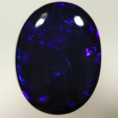 SOLID BLACK OPAL Royal blue rolling flashes. SEE VIDEO